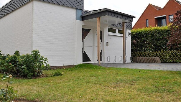 A modern two-story house with a white exterior and a grey roof. - Rosengrund by Interhome (Büsum)