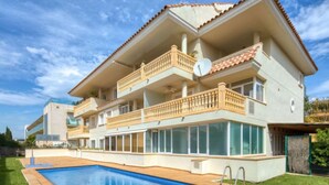 A multi-story building with a swimming pool, balconies, and large windows. - Residencial Roma by Interhome (Jávea)