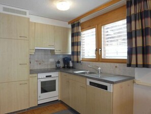 Enjoy cooking in this well-equipped kitchen with a dishwasher and stainless steel sink.