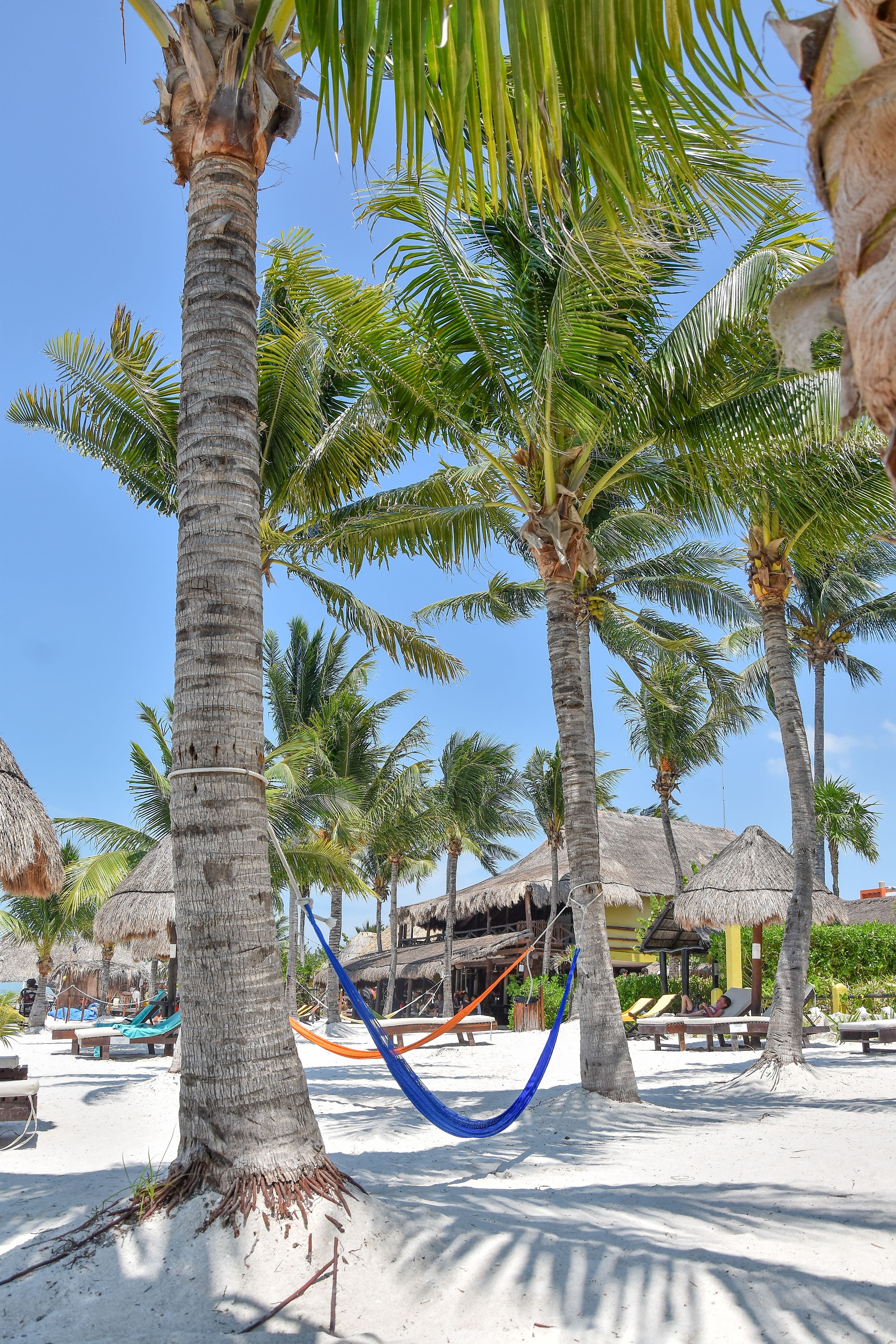 on the beach, white sand, sun-loungers, beach towels