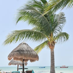 On the beach, white sand, sun-loungers, beach towels