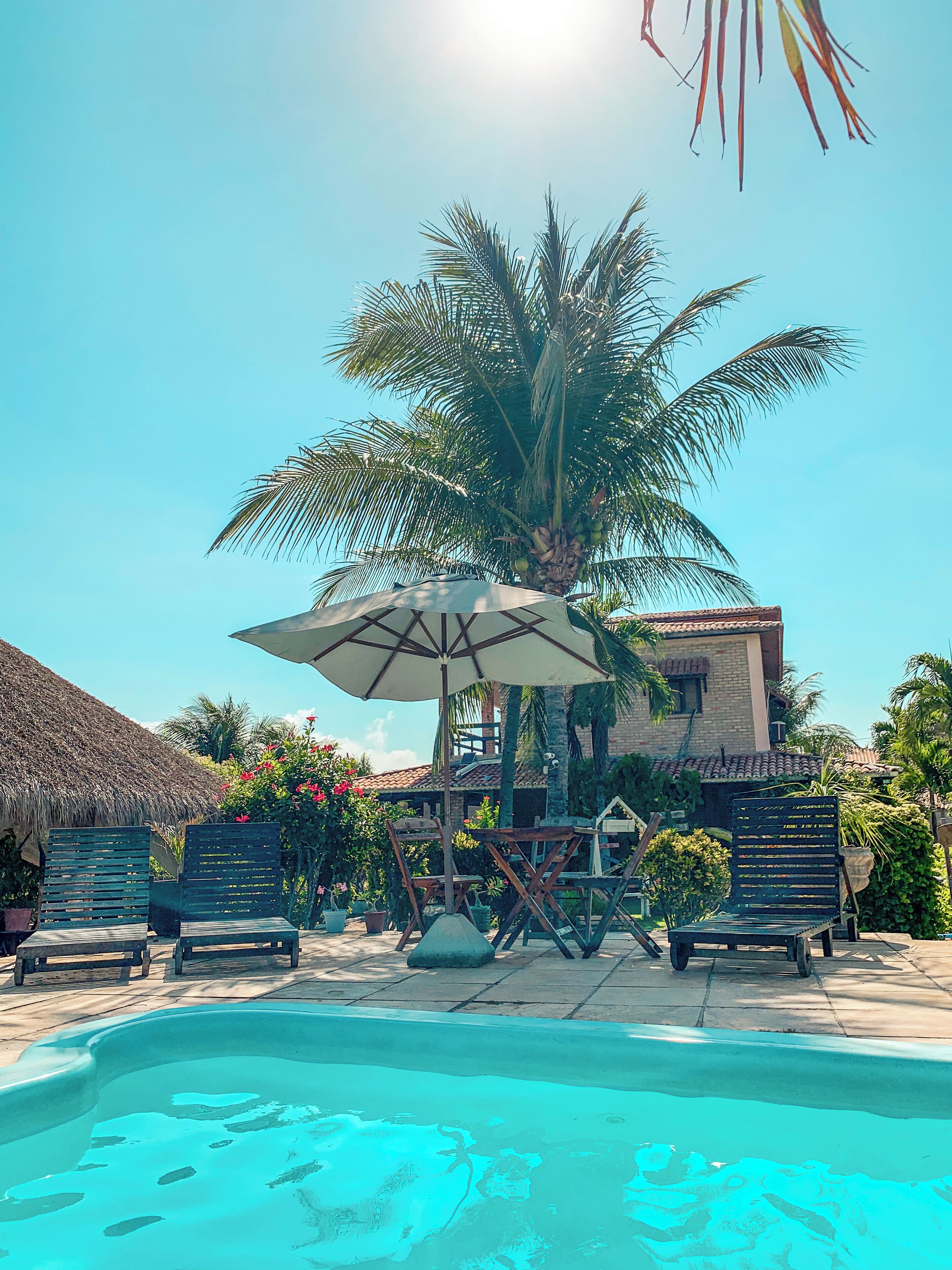 2 outdoor pools, open 8:00 AM to 10:00 PM, pool umbrellas, pool loungers