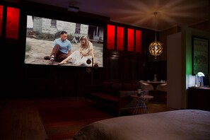 Elite Multi:LOFTS | Living area | 60-inch Smart TV with cable channels, TV, first-run movies - School 31 Lofts at Colors Studios (Rochester)