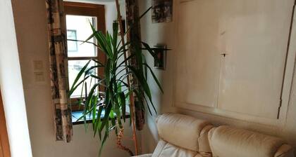 former. Farmhouse very central and quiet location