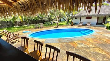 Outdoor pool, open 11:00 AM to 9:00 PM, pool loungers