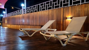 Seasonal outdoor pool, open 9:00 AM to 9:00 PM, pool umbrellas