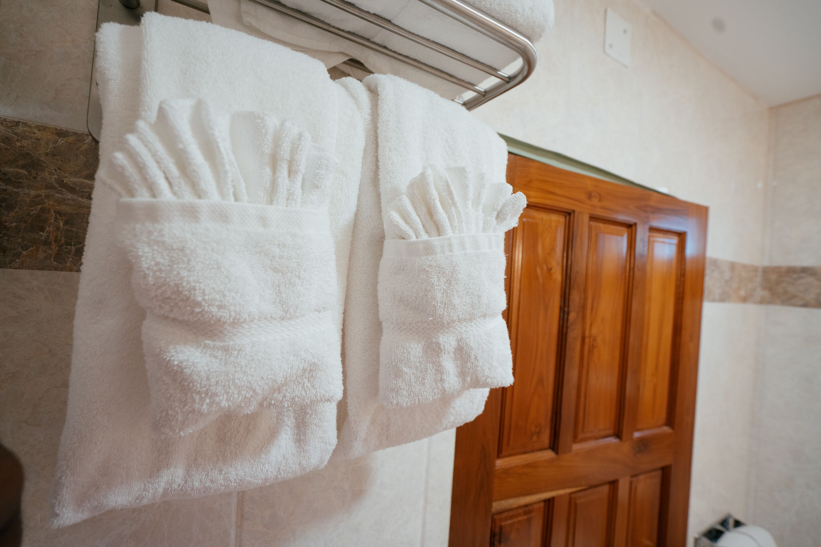 shower, rainfall showerhead, slippers, towels