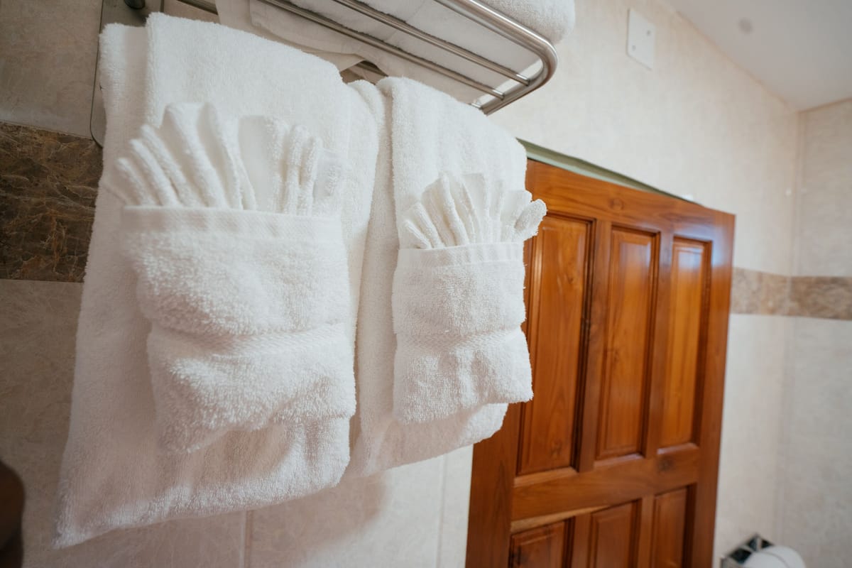 shower, rainfall showerhead, slippers, towels