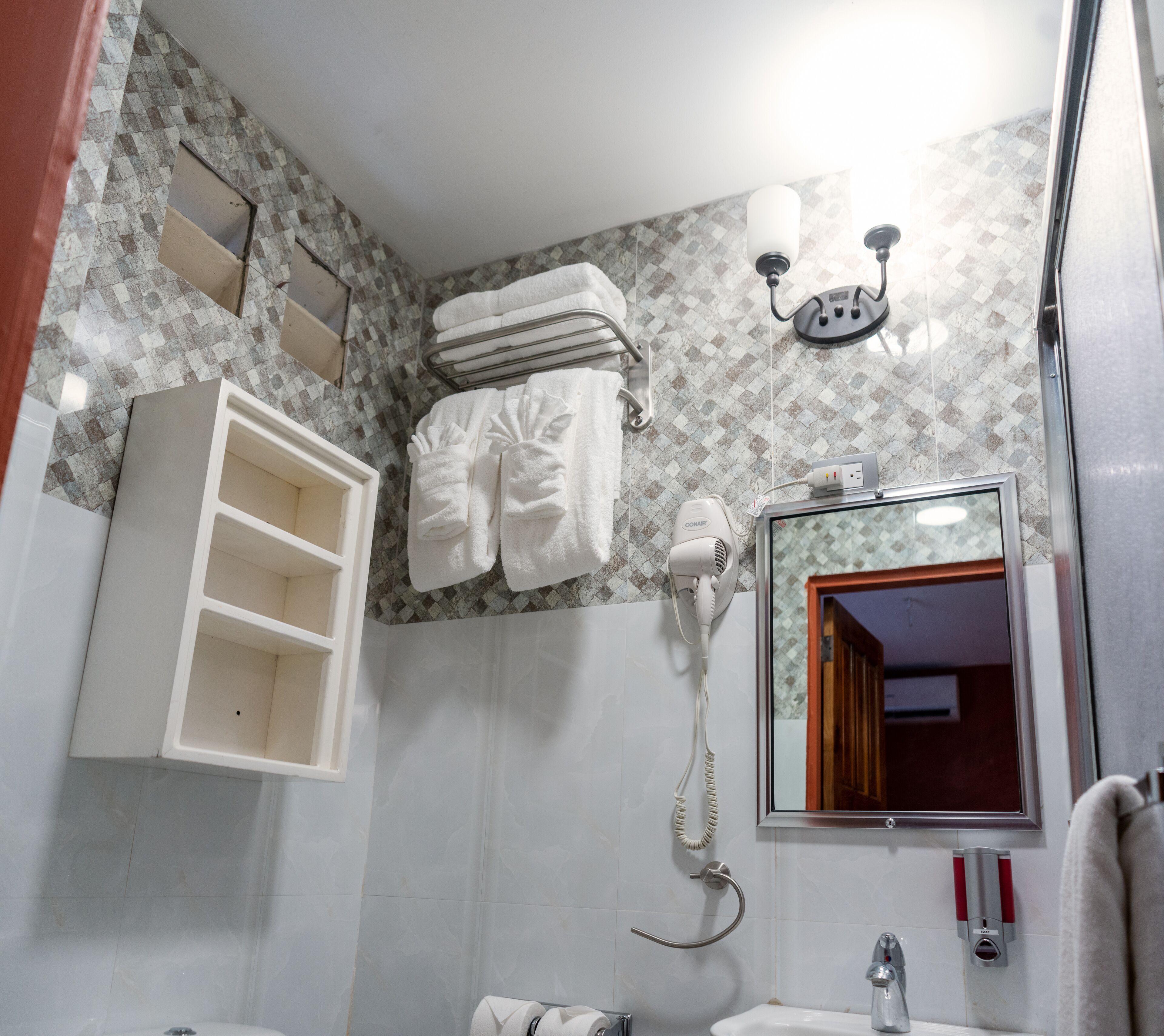 deluxe triple room | bathroom | shower, rainfall showerhead, slippers, towels