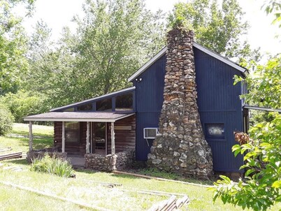 Spacious but cozy farmstead lodge has stone fireplace and sleeping for 9 to 10