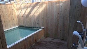 A wooden deck with a hot tub, a small sink, and a toilet. - Asia Hotel Kawaguchiko (Fujikawaguchiko)