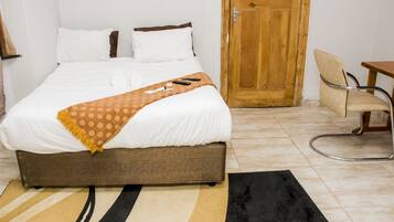 Habitació quàdruple | Planxa i posts de planxar, bressols, wifi gratuïta i roba de llit