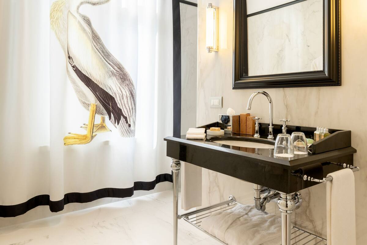 eco-friendly toiletries, hair dryer, bathrobes, slippers
