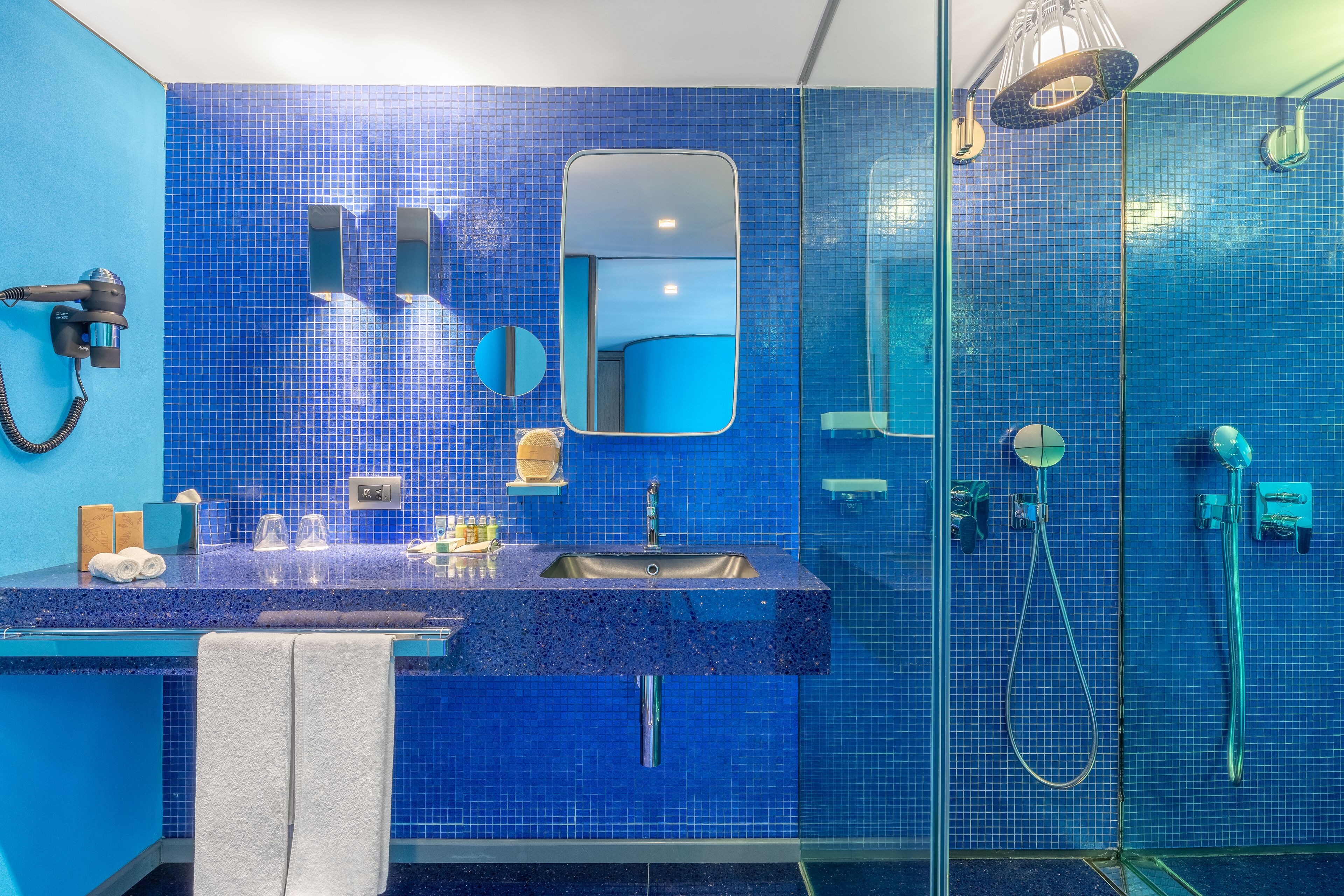 eco-friendly toiletries, hair dryer, bathrobes, slippers