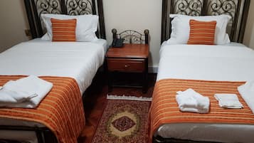 Premium bedding, memory foam beds, desk, laptop workspace