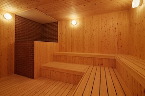 A wooden sauna with benches and a brick wall. - Yurakujo (Tomisato)
