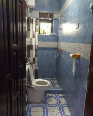Shower, free toiletries, slippers, towels