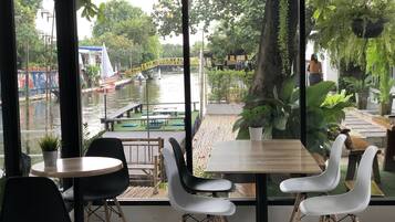 Breakfast, lunch served; Fusion cuisine, garden views