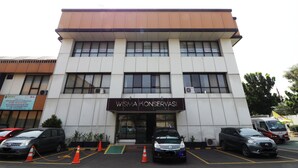 A building with a sign reading "Wisma Konservasi". - Wisma Konservasi (Jakarta)