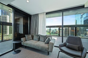 Terrace Suite | Living room | 49-inch Smart TV with digital channels, TV, streaming services - Vibe Hotel Melbourne (Melbourne)