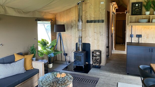 Superior Tent, 4 Bedrooms | Living area | Fireplace - Bear Lodge - At Port Lympne Reserve (Hythe)