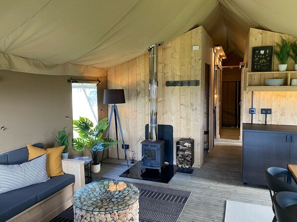 Superior Tent, 4 Bedrooms | Living area | Fireplace - Bear Lodge - At Port Lympne Reserve (Hythe)