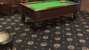 A billiards room with a pool table, chairs, and framed pictures on the walls. - Dinorben Arms Hotel (Amlwch)