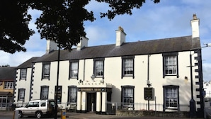 A two-story building with a sign reading "Dinorben Arms." - Dinorben Arms Hotel (Amlwch)