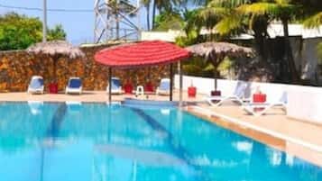 Indoor pool, open 6:00 AM to 7:00 PM, pool umbrellas, pool loungers