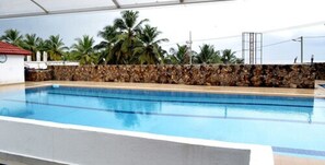 Indoor pool, open 6:00 AM to 7:00 PM, pool umbrellas, sun loungers
