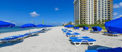 On the beach, sun loungers, beach towels