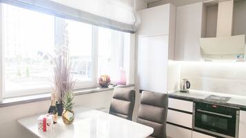 Family Apartment, 1 Bedroom | Private kitchen | Fridge, microwave, oven, stovetop