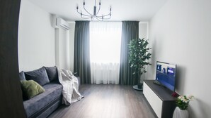 Familienapartment, 1 Schlafzimmer | 1 Schlafzimmer, Bügeleisen/Bügelbrett, kostenloses WLAN, Bettwäsche