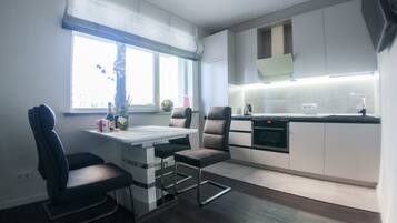 Family Apartment, 1 Bedroom | Private kitchen | Fridge, microwave, oven, stovetop