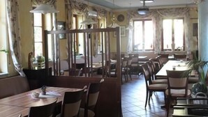 A spacious dining area with multiple tables and chairs, large windows allowing natural light, and decorative ceiling elements. - Hotel Krone Kappel (Kappel-Grafenhausen)