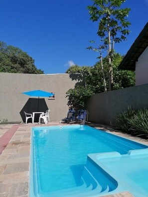 Outdoor pool, pool umbrellas, sun loungers