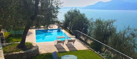 Seasonal outdoor pool, open 9:00 AM to 8:00 PM, pool umbrellas