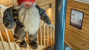 A wooden cabin interior with a hanging Santa Claus decoration. - Pyrykieppi by Interhome (Rovaniemi)