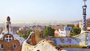 A view of a cityscape with a distinctive building featuring colorful mosaic tiles and unique architectural elements. - Vila Olímpica: Sant Martí - Sardenya by Interhome (Barcelona)