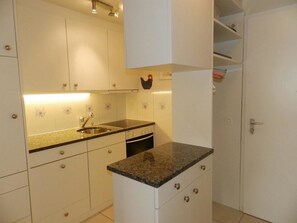 Fridge, dishwasher, high chair, cookware/dishes/utensils