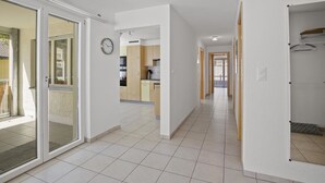 A modern apartment with a kitchen, a living area, and a bathroom. - Apartment Ruggli by Interhome (Churwalden)