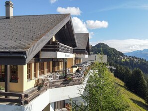 A restaurant with outdoor seating on a hillside, overlooking a mountainous landscape. - Zurschmitten 15 1. UG Süd by Interhome (Riederalp)