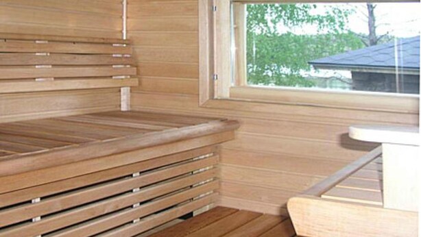 A sauna room with wooden benches and a window. - Rantamökki by Interhome (Luhanka)
