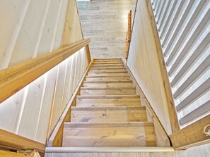 A wooden staircase with a modern design, leading to a room with a light-colored floor. - Sopukka by Interhome (Sotkamo)