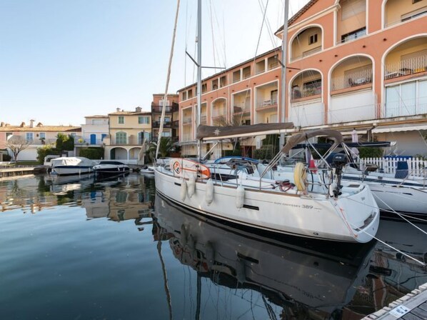 A marina with several sailboats docked.