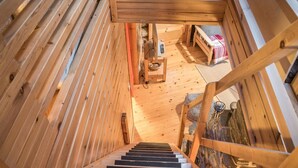 A wooden staircase leading to a loft bedroom with a view of the interior. - Ylläsparit as. 2 by Interhome (Ylläsjärvi)