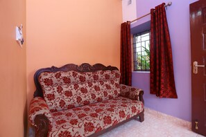 Grand Cottage | Living area | 32-inch LED TV with satellite channels, TV - Dream Land Hill Residency (Peermade)