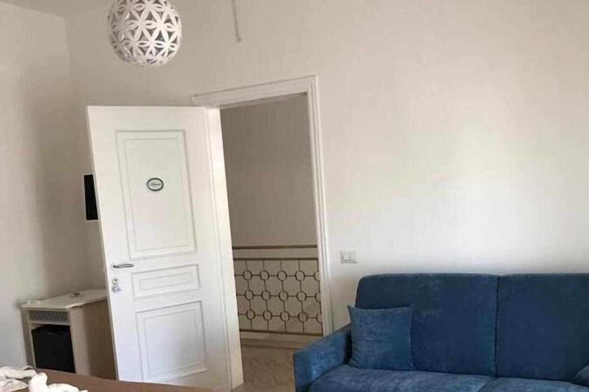 Habitación cuádruple estándar | Cunas gratuitas, wifi gratis y ropa de cama