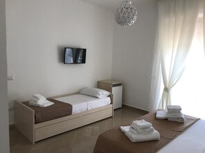 Triple Room, Private Bathroom | Free cribs/infant beds, free WiFi, bed sheets