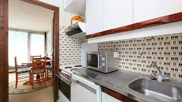 Fridge, microwave, cookware/dishes/utensils